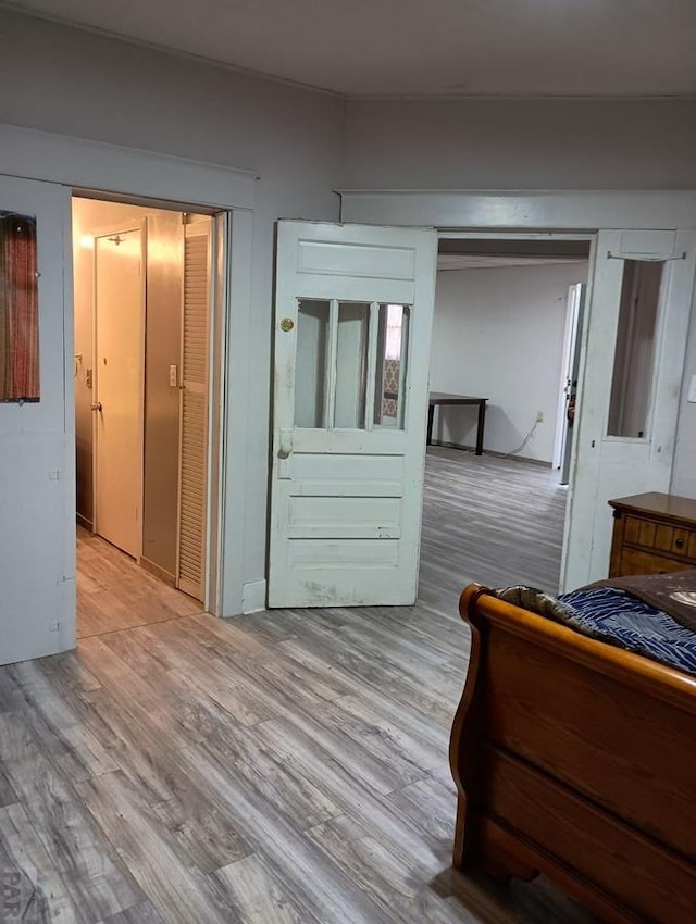 unfurnished bedroom with light wood-style floors
