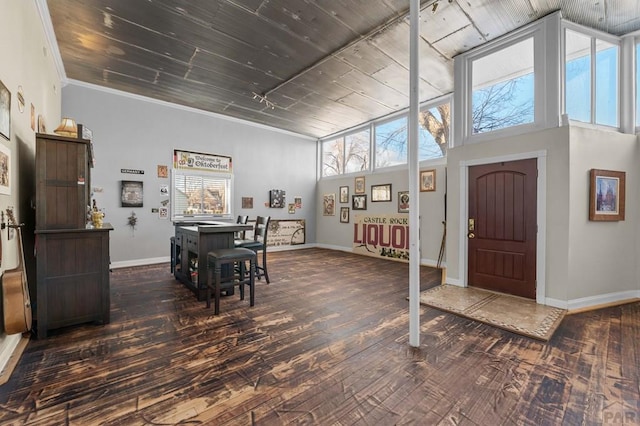 foyer with wood ceiling, baseboards, and dark wood finished floors