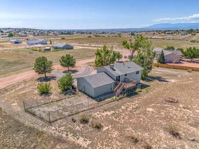 bird's eye view featuring a rural view and a mountain view