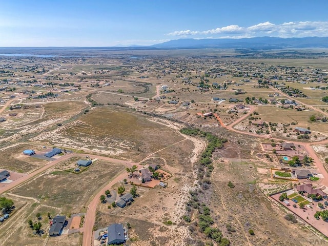 aerial view featuring view of desert and a mountain view