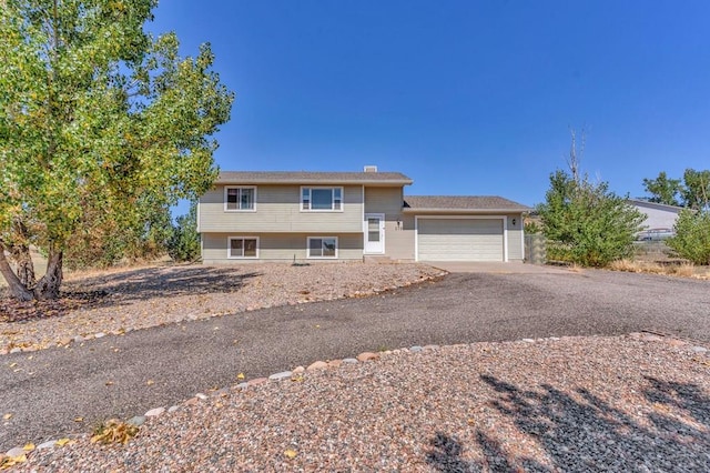 view of front of home featuring a garage and driveway