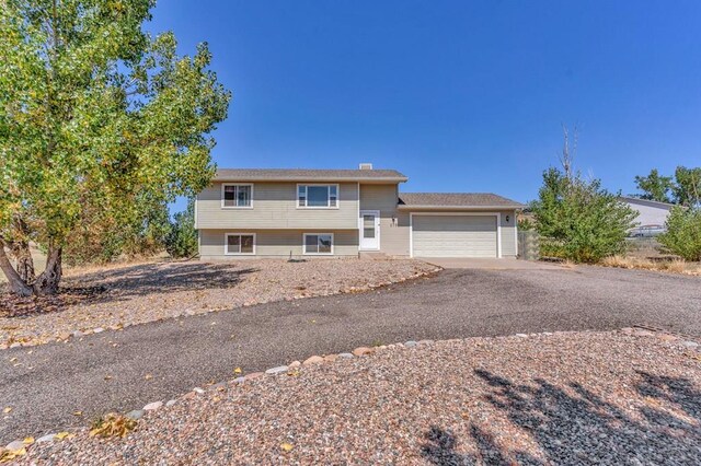 view of front of home featuring a garage and driveway