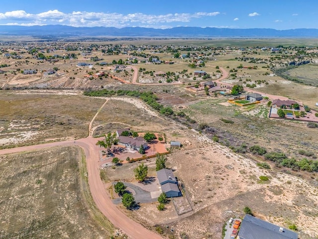 drone / aerial view featuring a mountain view