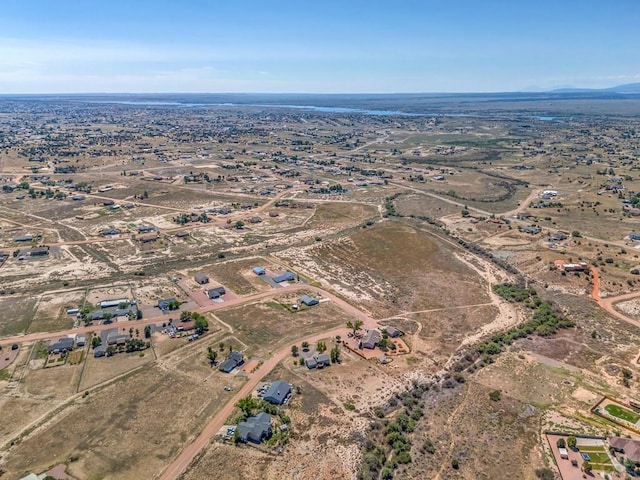 bird's eye view with a rural view and a desert view