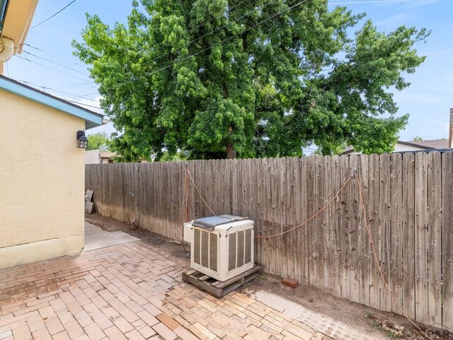 1128 W Summit Ave, Pueblo, CO 81004 - fenced backyard with a patio area