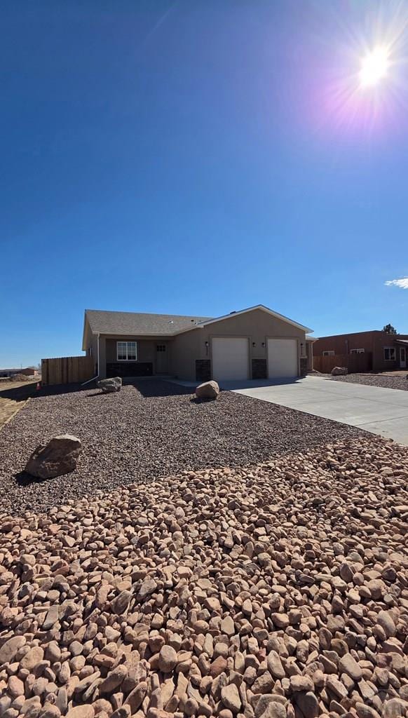 view of front of home with a garage and concrete driveway