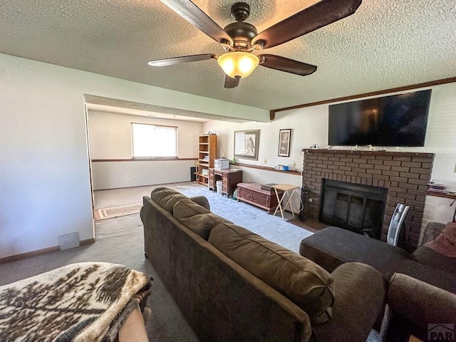 living room featuring carpet floors, a textured ceiling, a brick fireplace, and ceiling fan