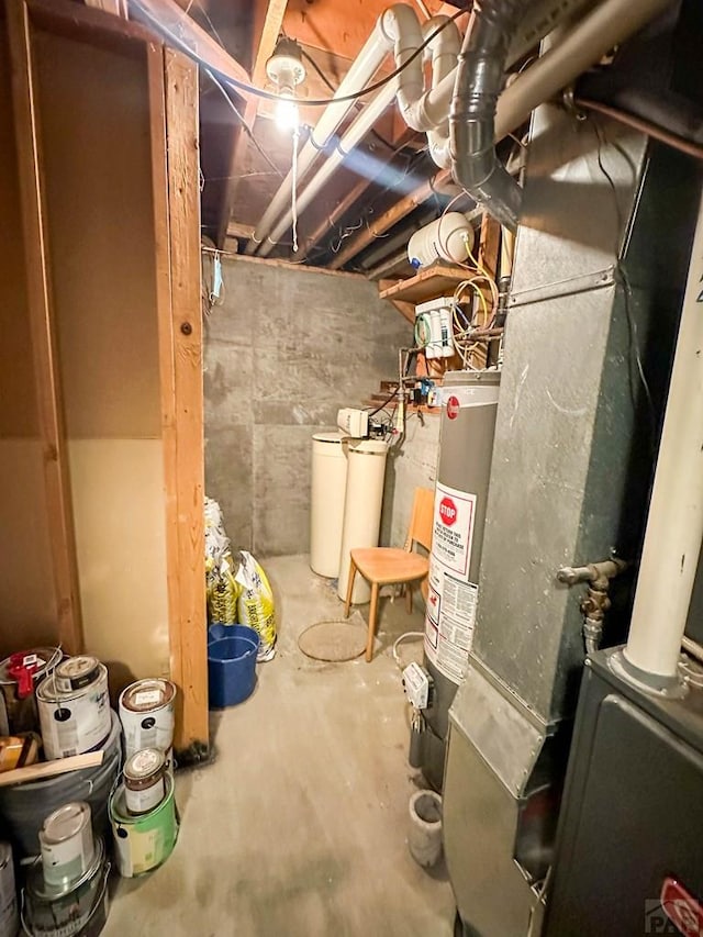 unfinished basement with heating unit and gas water heater