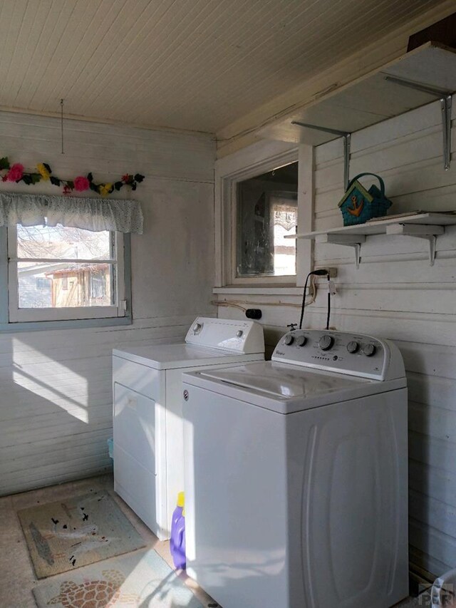 washroom featuring laundry area, separate washer and dryer, and wood ceiling