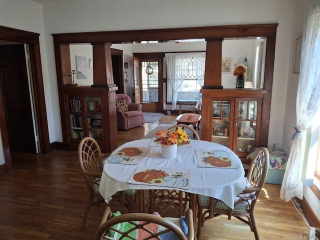 dining area with wood finished floors and baseboards