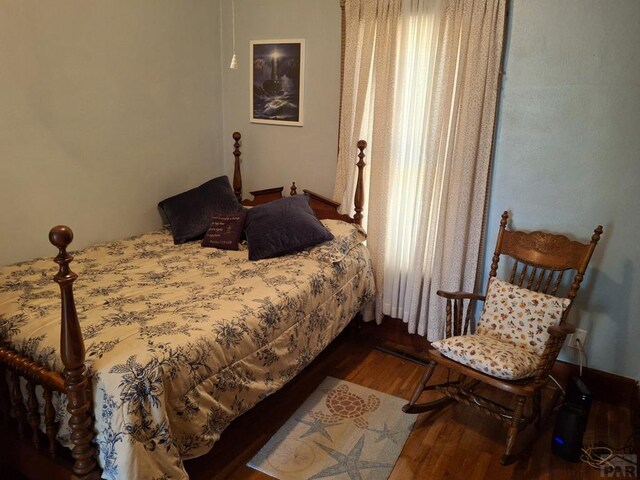 bedroom with wood finished floors