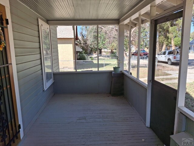 unfurnished sunroom featuring wooden ceiling