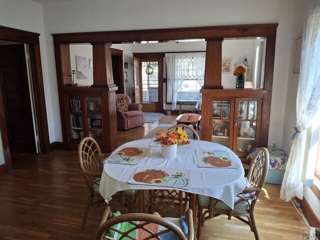 dining room with wood finished floors and baseboards