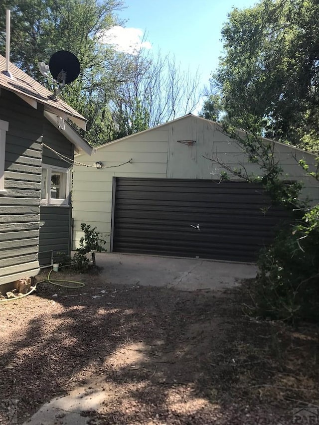 garage featuring driveway