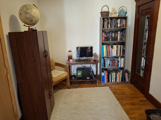 sitting room with wood finished floors