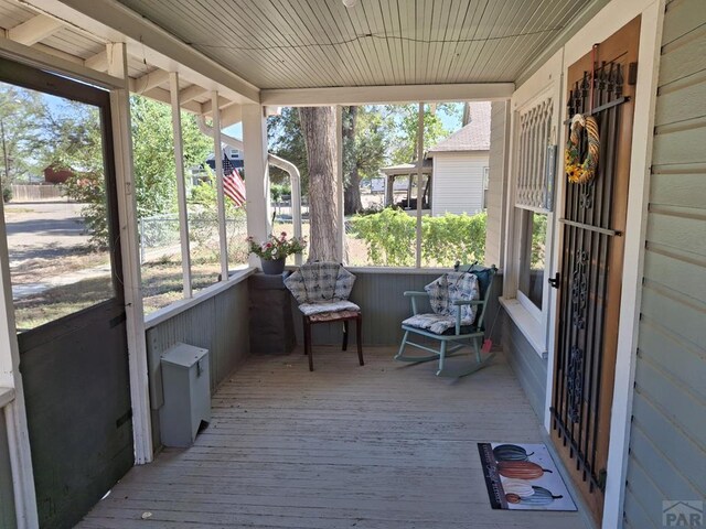 sunroom with wood ceiling