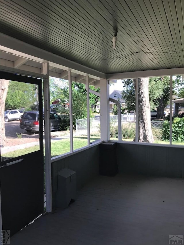 unfurnished sunroom featuring a wealth of natural light