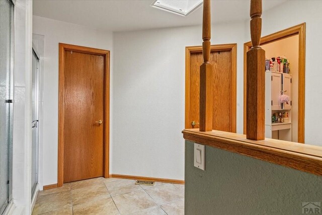 137 W Glenrose Dr, Pueblo West, CO 81007 - corridor with light tile patterned floors and baseboards