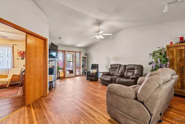 137 W Glenrose Dr, Pueblo West, CO 81007 - living area with a ceiling fan, light wood-type flooring, and vaulted ceiling