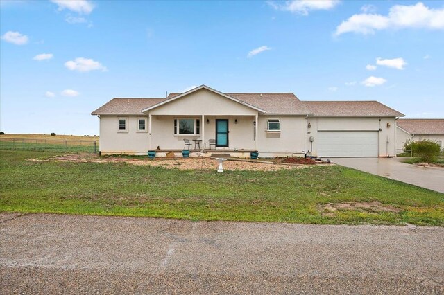 49 N Pkwy, Colorado City, CO 81019 - single story home featuring a garage, driveway, and stucco siding