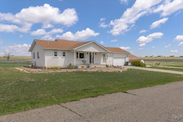 49 N Pkwy, Colorado City, CO 81019 - single story home with a porch, driveway, a garage, and stucco siding