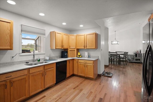 49 N Pkwy, Colorado City, CO 81019 - kitchen with dishwasher, a sink, light wood-style flooring, light countertops, and recessed lighting