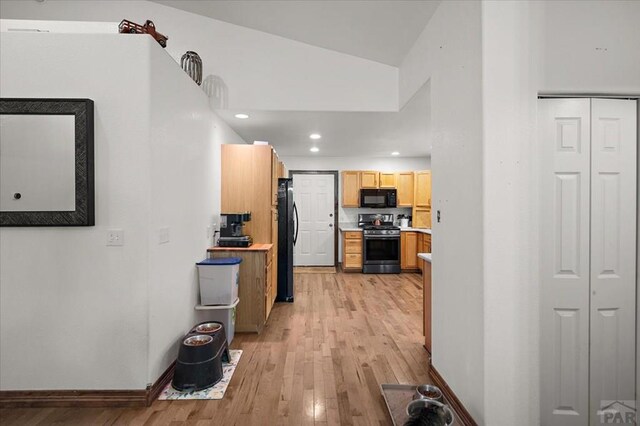 49 N Pkwy, Colorado City, CO 81019 - kitchen featuring black appliances, light wood-style flooring, light countertops, baseboards, and recessed lighting