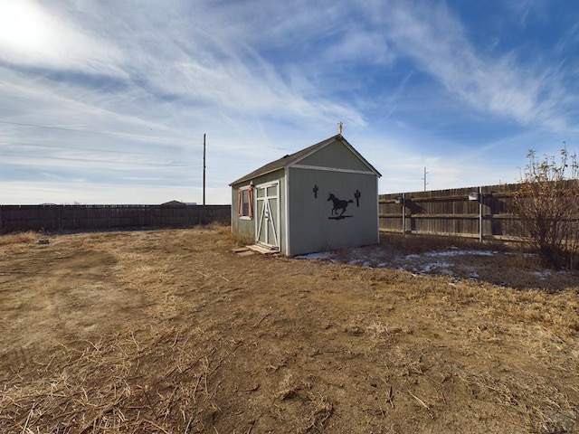 view of shed featuring a fenced backyard