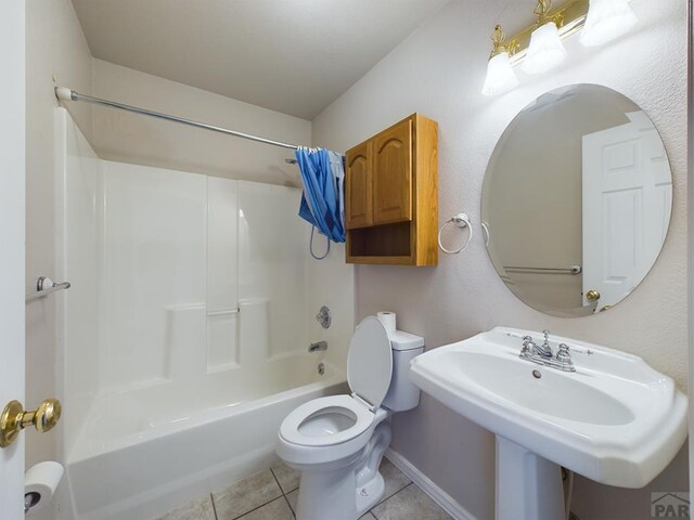 full bath with tub / shower combination, toilet, and tile patterned floors