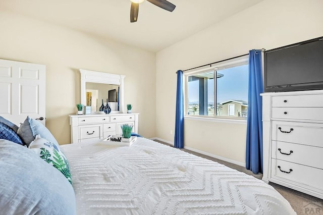 carpeted bedroom with baseboards and ceiling fan