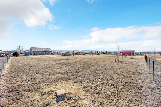 view of home's community with fence