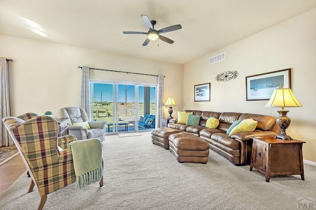 living room with visible vents and ceiling fan