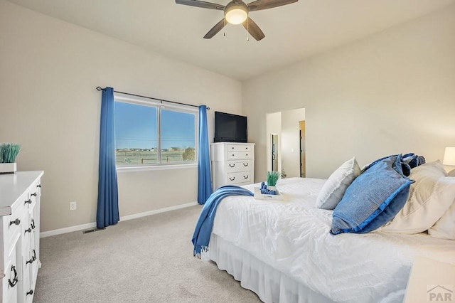 bedroom featuring light carpet, visible vents, a ceiling fan, and baseboards