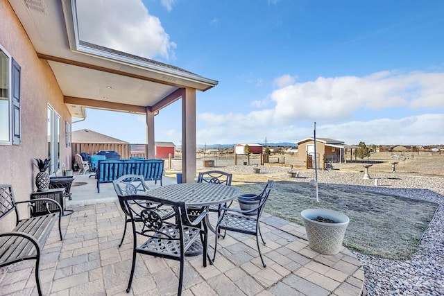 view of patio / terrace featuring outdoor dining area, outdoor lounge area, and fence