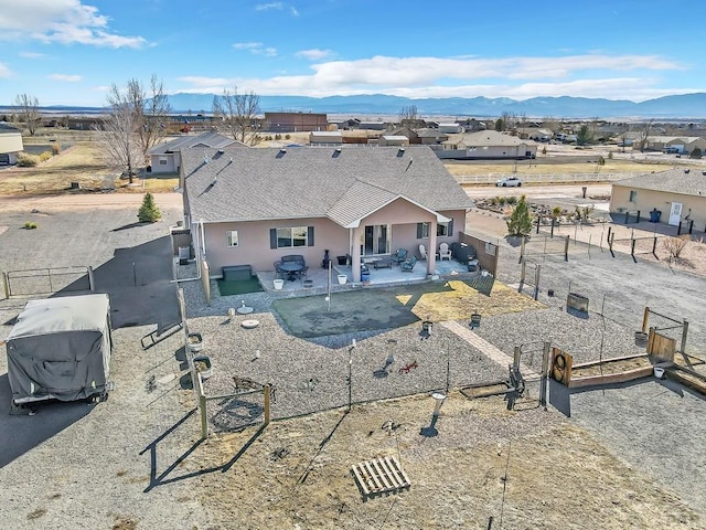 birds eye view of property featuring a mountain view