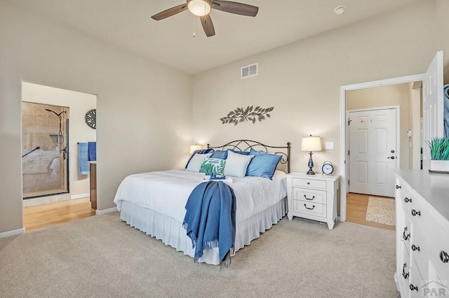 bedroom featuring visible vents, baseboards, light colored carpet, and a ceiling fan