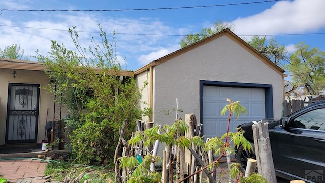 view of side of home featuring stucco siding