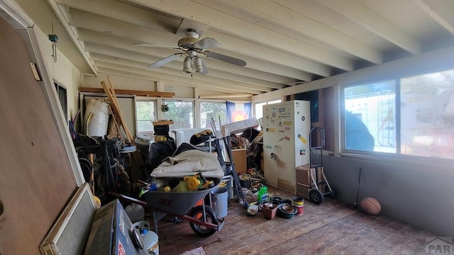 sunroom / solarium with beam ceiling and a healthy amount of sunlight