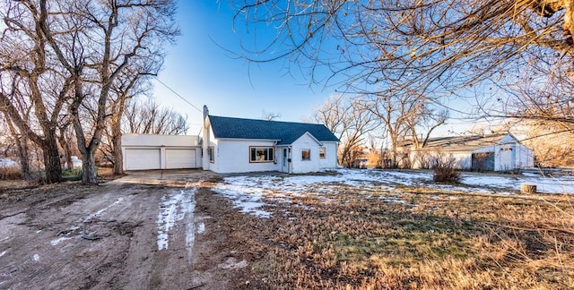 view of front of home with a garage and driveway