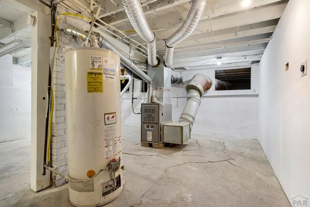 utility room with water heater