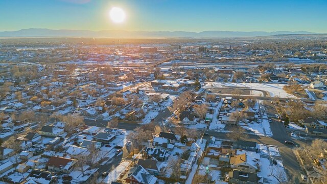 drone / aerial view featuring a residential view and a mountain view