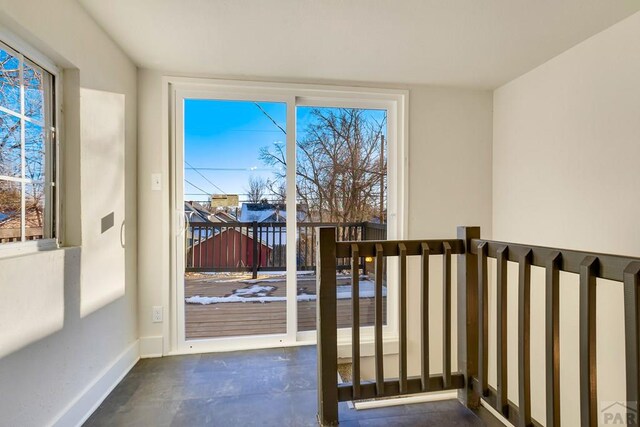 entryway featuring baseboards