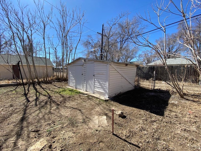 view of shed with fence