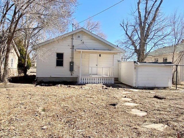 back of house with covered porch