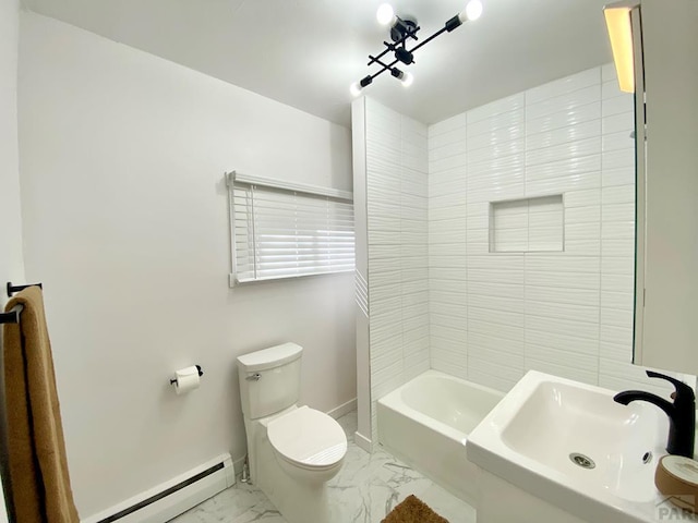 bathroom with baseboards, toilet, marble finish floor, baseboard heating, and a sink