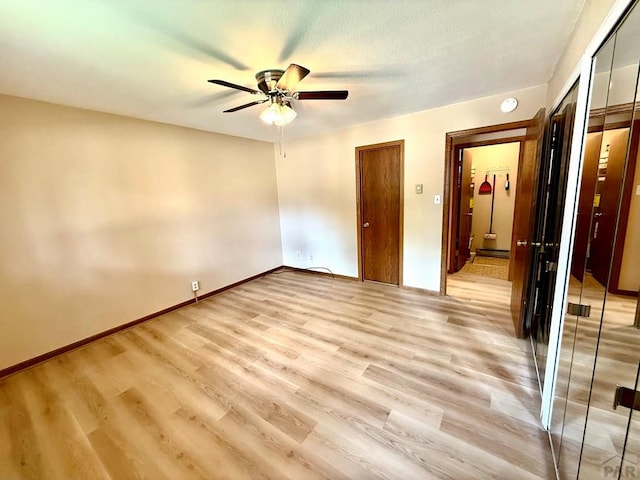 2302 Cartier Dr Unit A, Pueblo, CO 81005 - unfurnished bedroom with light wood-style floors, a ceiling fan, and a baseboard heating unit