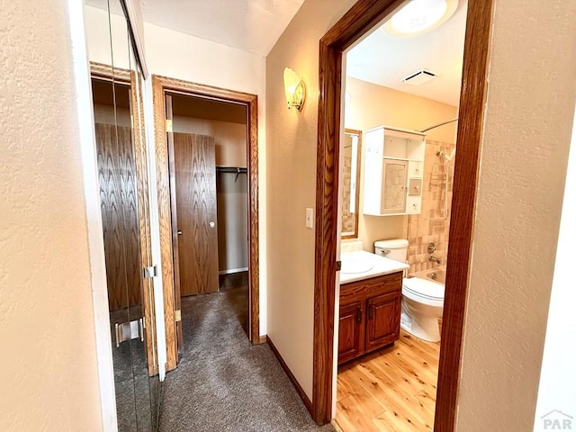 2302 Cartier Dr Unit A, Pueblo, CO 81005 - corridor with a textured wall and light wood-style flooring