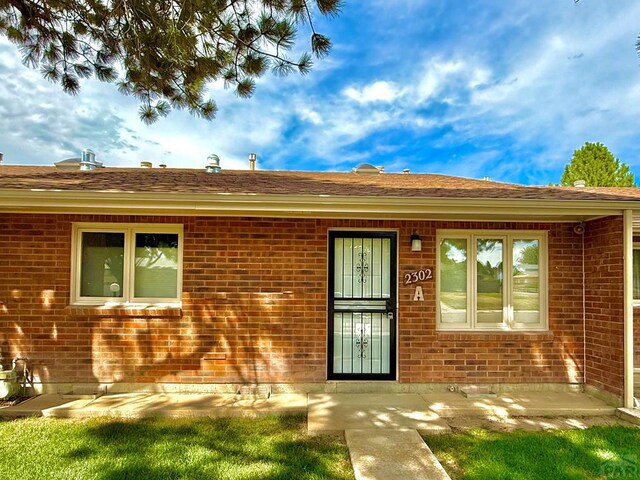 2302 Cartier Dr Unit A, Pueblo, CO 81005 - view of front of home with brick siding