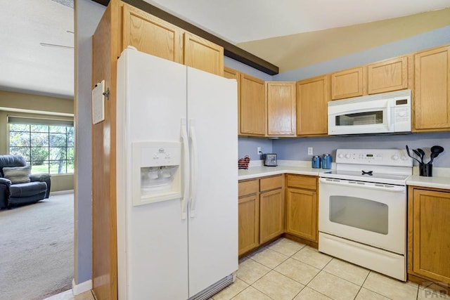 kitchen with light countertops, light tile patterned floors, light carpet, and white appliances