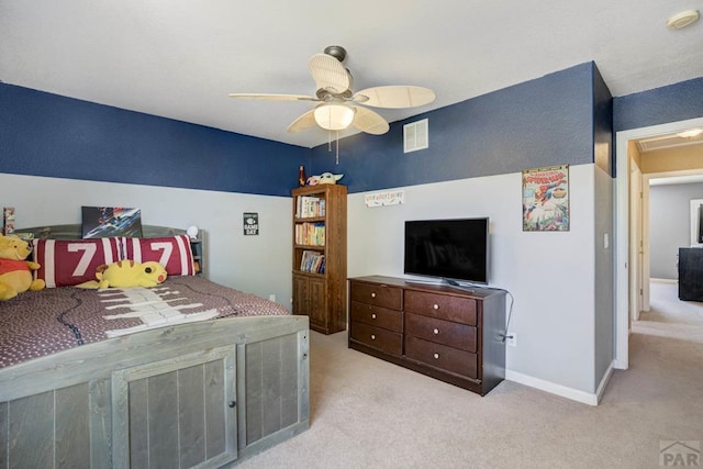 bedroom featuring a ceiling fan, baseboards, light colored carpet, and visible vents